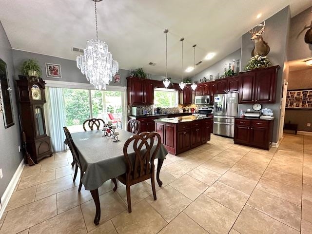 3123 Jeter Road Clifton, TN 38425 - Photo 12 of 40 a view of a dining room with furniture a chandelier and kitchen view