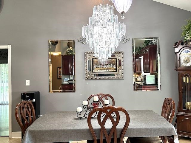 3123 Jeter Road Clifton, TN 38425 - Photo 13 of 40 a view of a dining room with furniture and chandelier