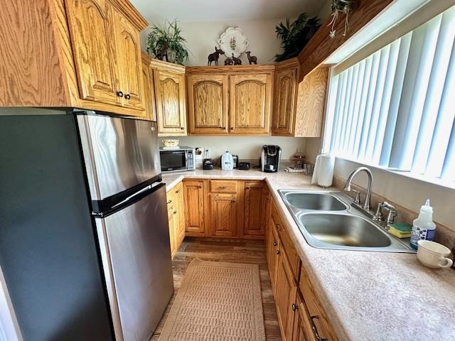 3123 Jeter Road Clifton, TN 38425 - Photo 25 of 40 a kitchen with refrigerator a sink and cabinets