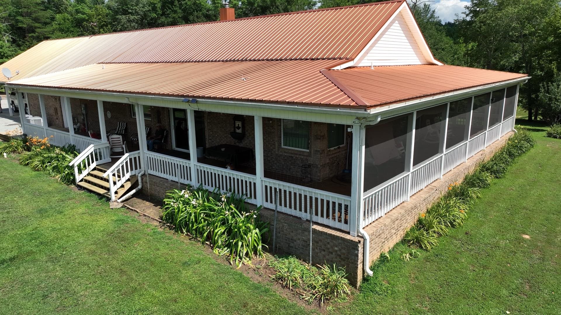 3123 Jeter Road Clifton, TN 38425 - Photo 30 of 40 a front view of a house with a yard