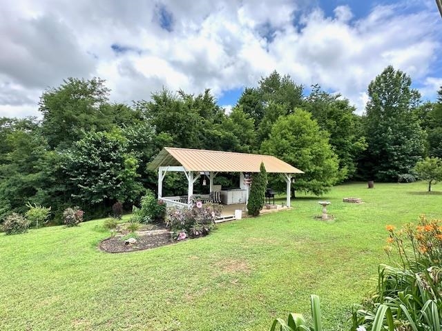 3123 Jeter Road Clifton, TN 38425 - Photo 32 of 40 a view of a house with backyard and sitting area