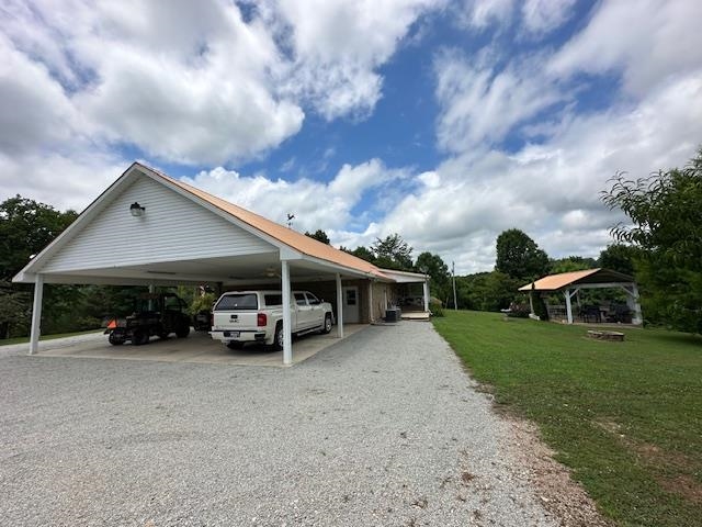 3123 Jeter Road Clifton, TN 38425 - Photo 36 of 40 a view of a house with a patio and a yard