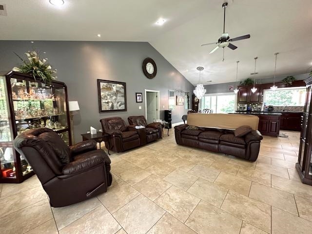 3123 Jeter Road Clifton, TN 38425 - Photo 7 of 40 a living room with furniture a chandelier and kitchen view