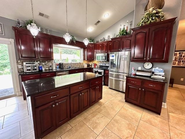 3123 Jeter Road Clifton, TN 38425 - Photo 8 of 40 a kitchen with granite countertop stainless steel appliances and wooden cabinets