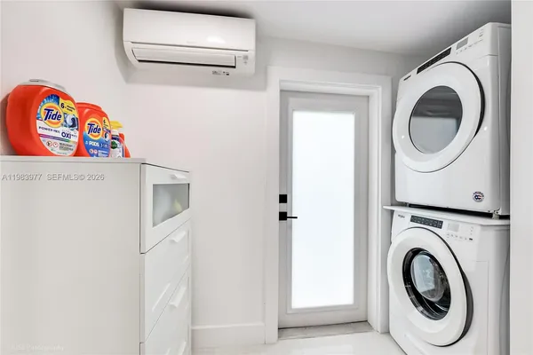 a utility room with dryer and washer