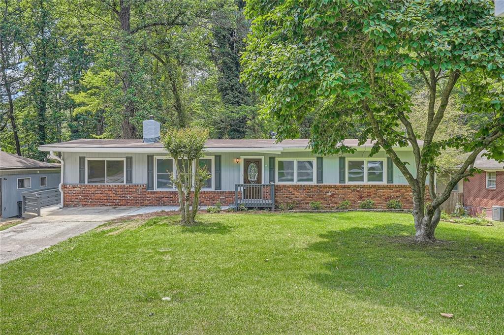 front view of a house with a yard