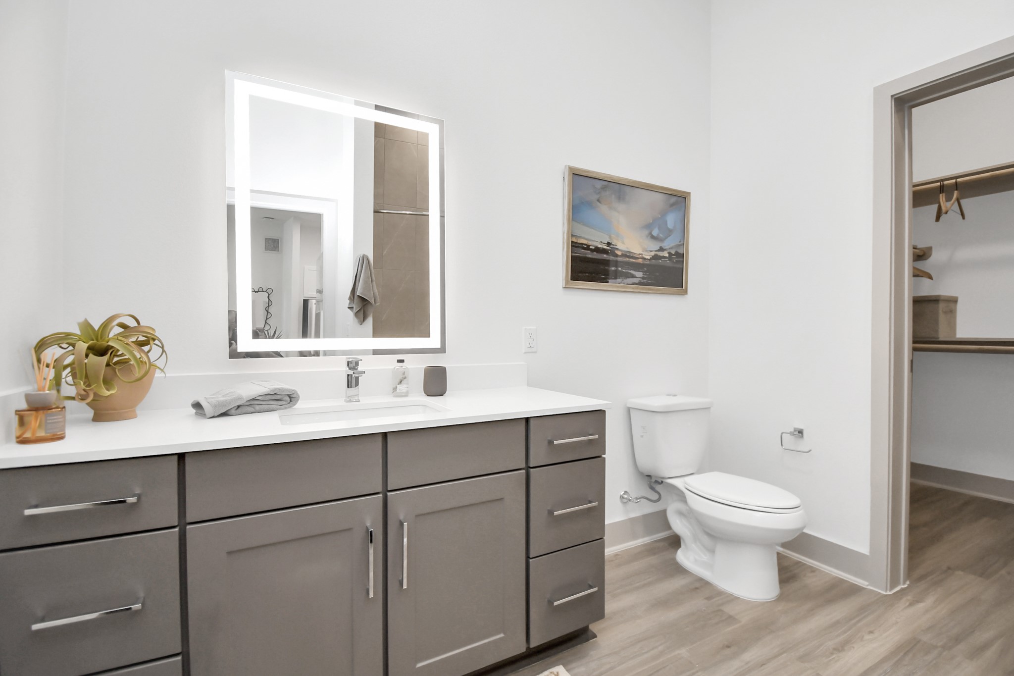 1617 Enid Street, Unit 177 Houston, TX 77009 - Photo 17 of 50 a bathroom with a toilet a sink a mirror and a window