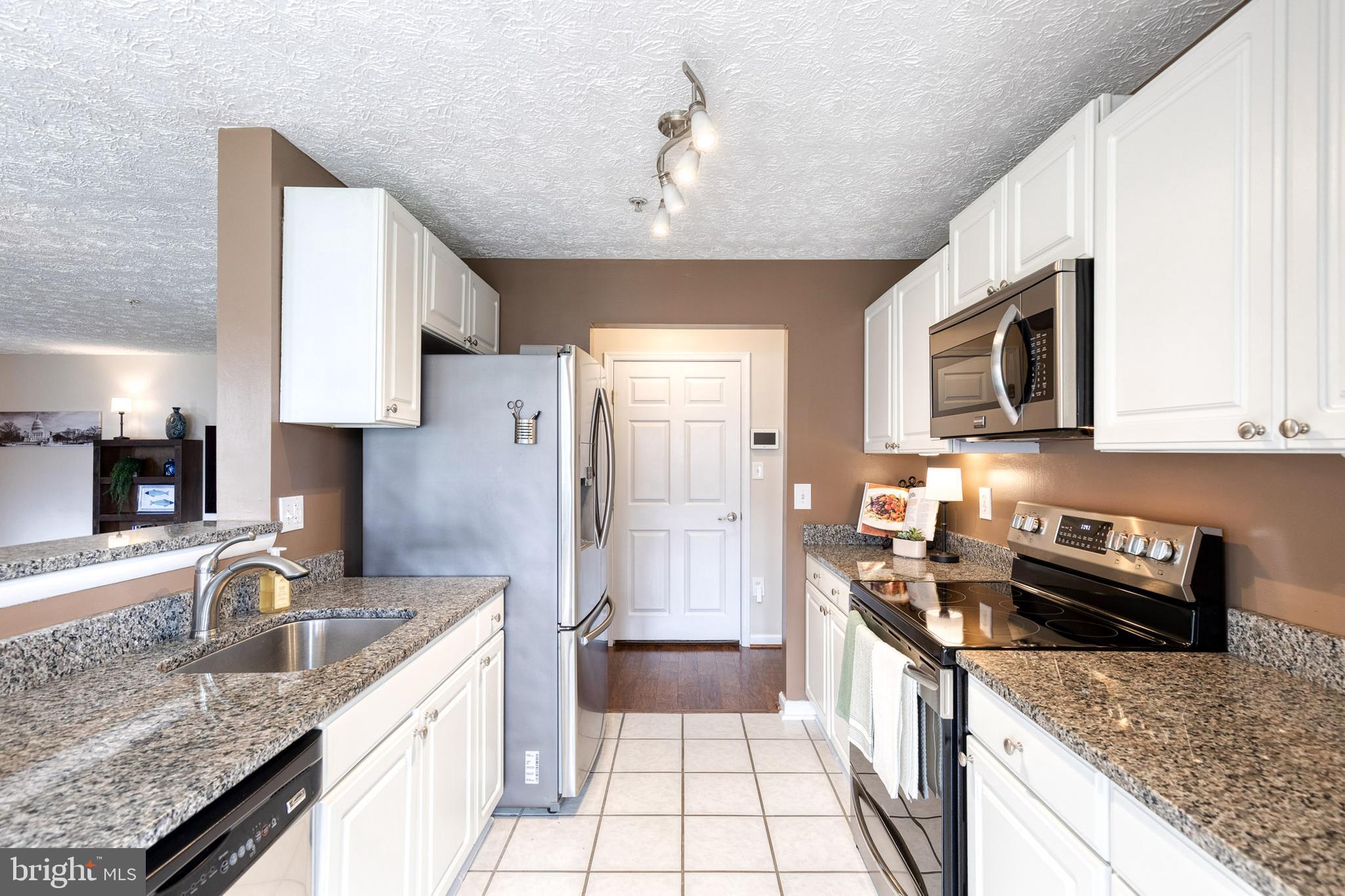 2445 Blue Spring Court, Unit 102 Odenton, MD 21113 - Photo 10 of 30 Functional kitchen w/ stainless steal appliances