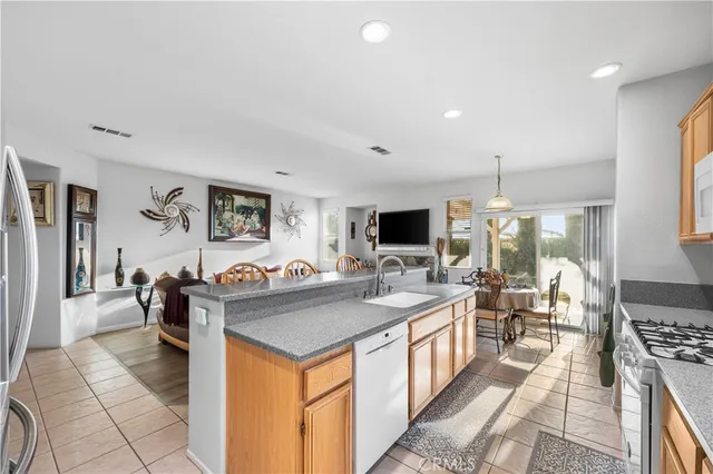 a kitchen with a stove and a refrigerator