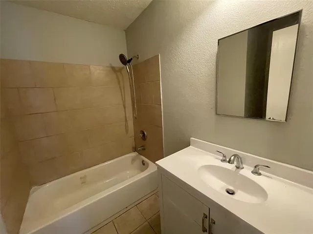a bathroom with a sink and a bathtub