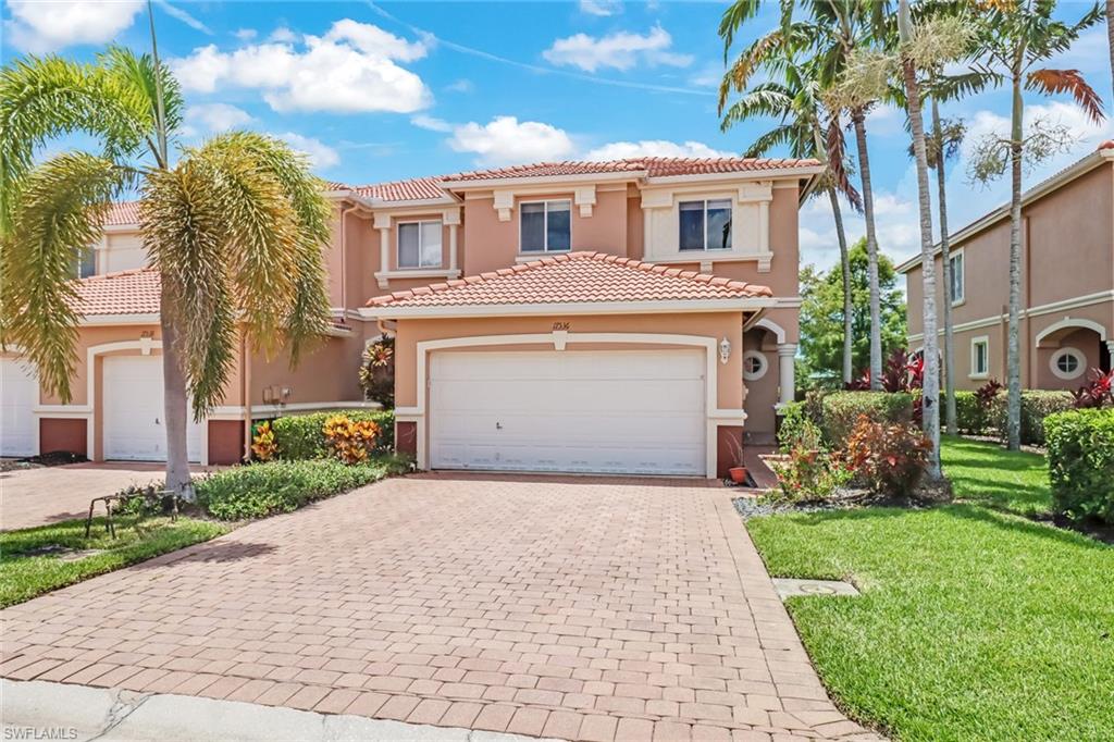 17536 Cherry Ridge Lane Fort Myers, FL 33967 - Photo 1 of 26 a front view of a house with a garden and plants