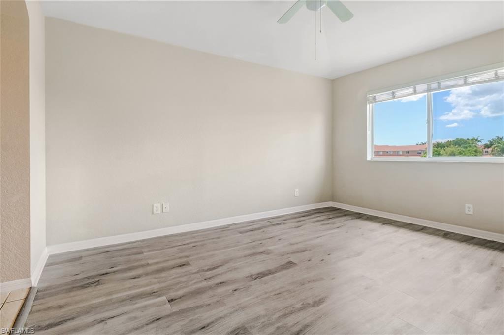 17536 Cherry Ridge Lane Fort Myers, FL 33967 - Photo 14 of 26 wooden floor in an empty room with a window