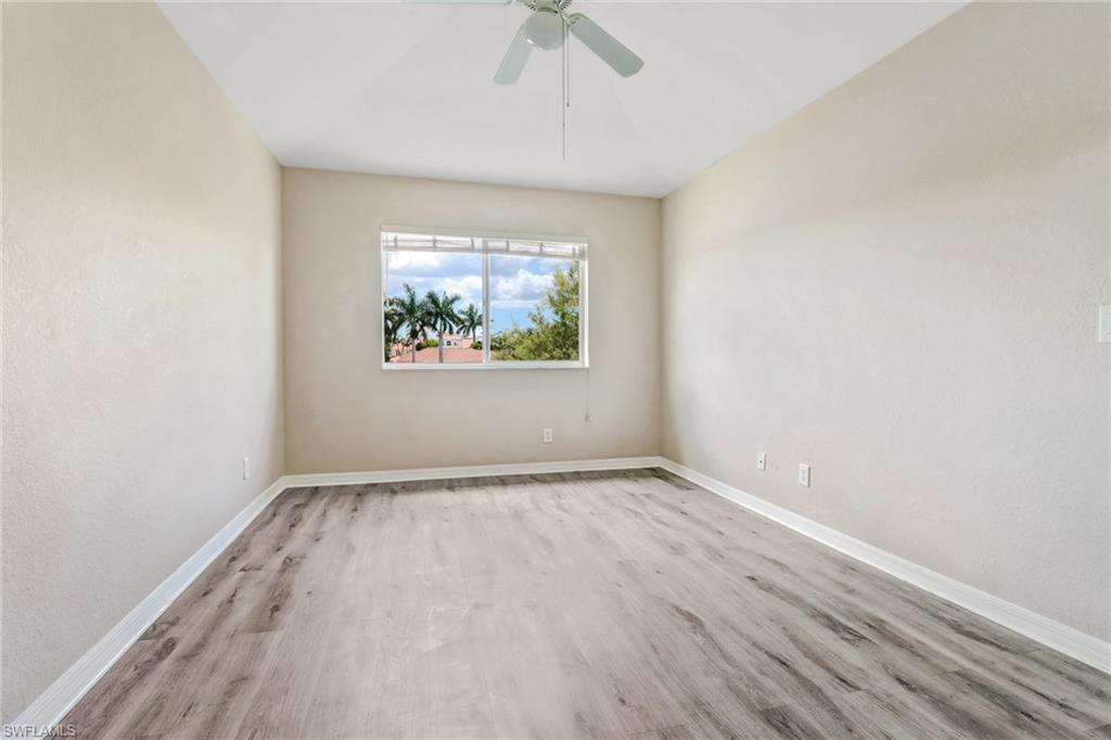 17536 Cherry Ridge Lane Fort Myers, FL 33967 - Photo 15 of 26 an empty room with a window and a ceiling fan