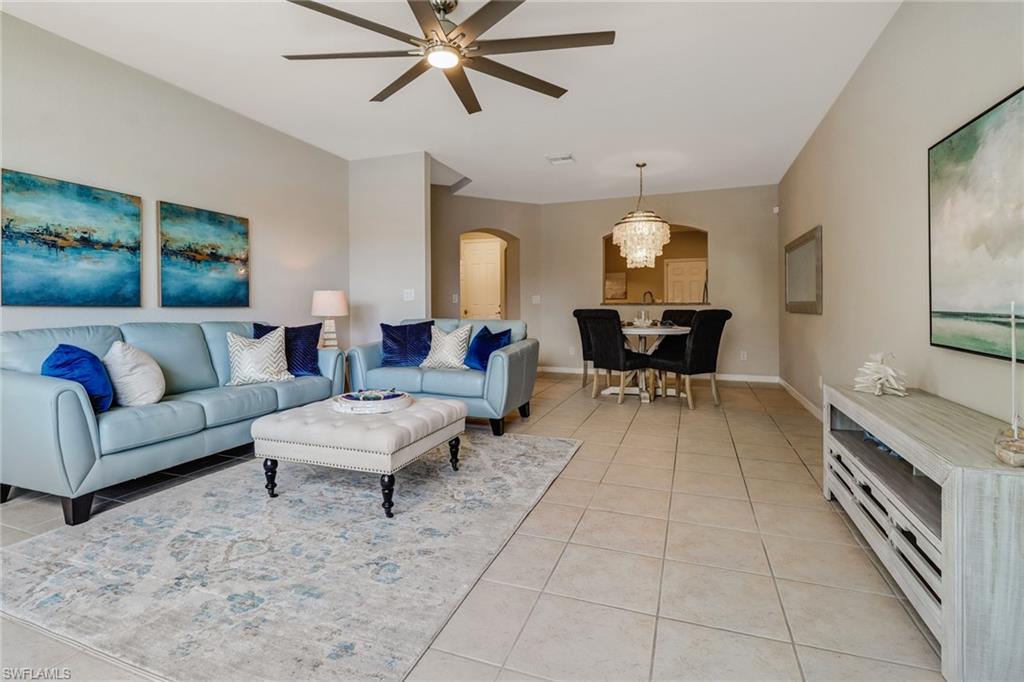 17536 Cherry Ridge Lane Fort Myers, FL 33967 - Photo 4 of 26 a living room with furniture and a chandelier