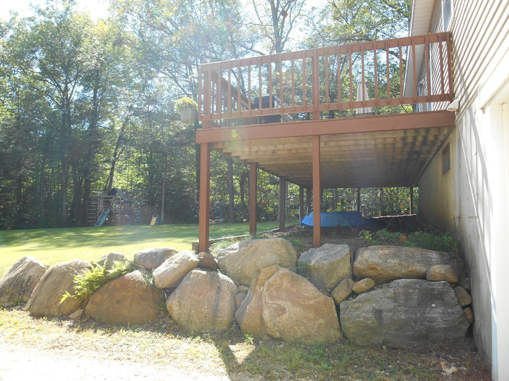 23 Reed Hill Road Wales, MA 01081 - Photo 20 of 21 a backyard of a house with table and chairs