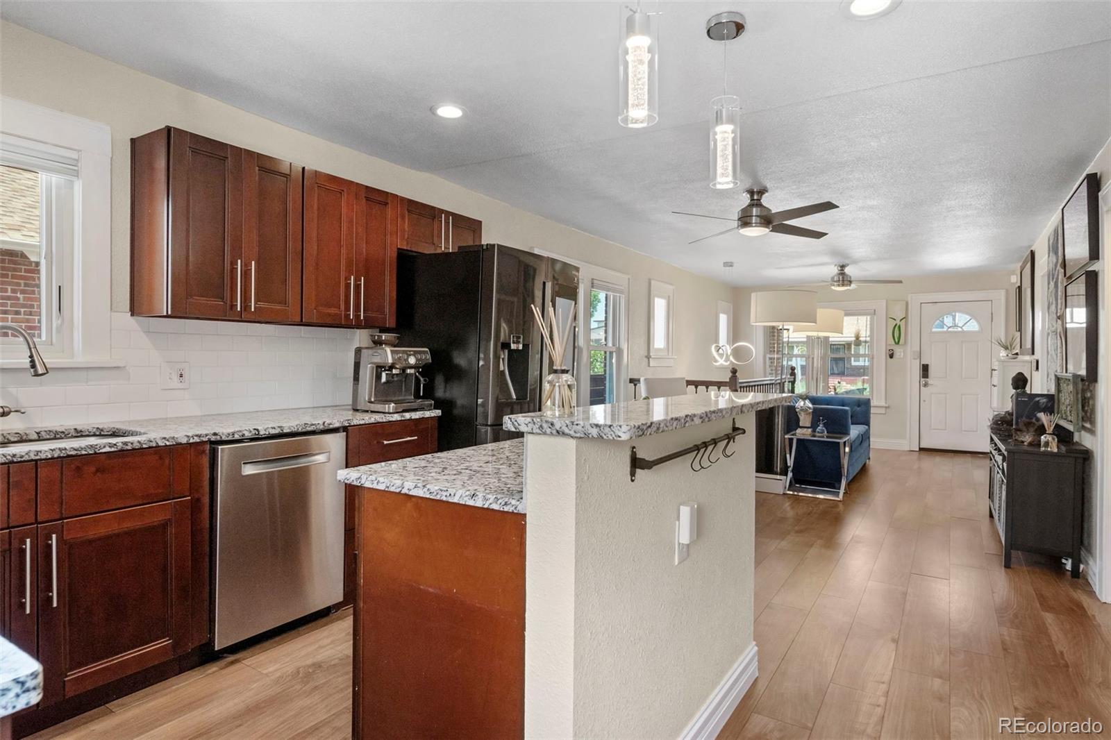 4319 Raritan Street Denver, CO 80211 - Photo 11 of 27 a kitchen with stove and refrigerator