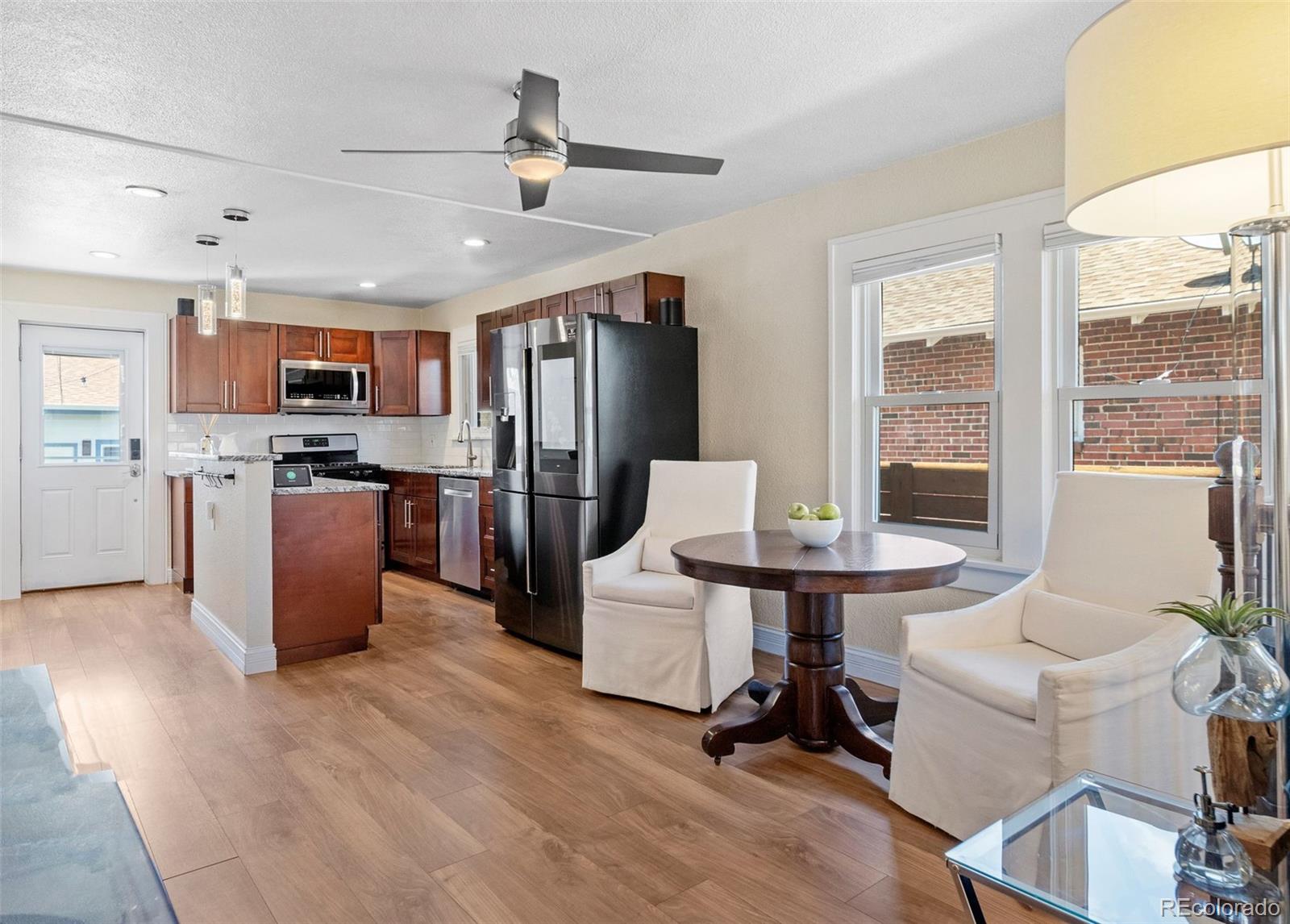 4319 Raritan Street Denver, CO 80211 - Photo 14 of 27 a work room with furniture and a kitchen view