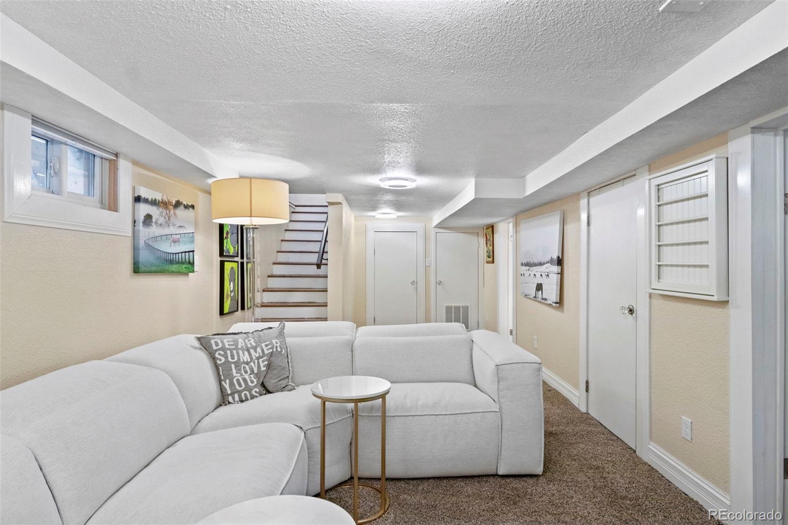 4319 Raritan Street Denver, CO 80211 - Photo 18 of 27 a living room with furniture and a window