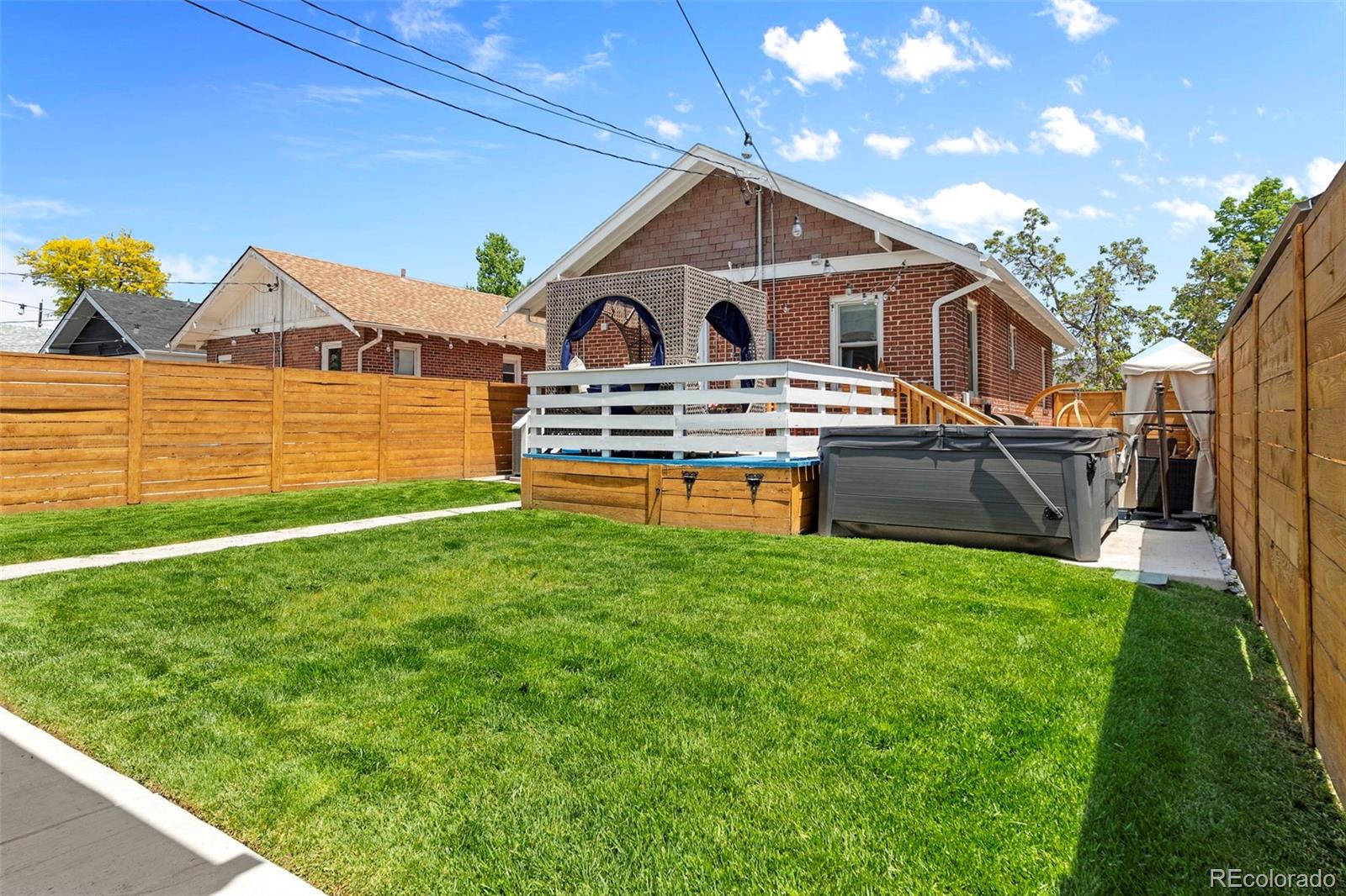 4319 Raritan Street Denver, CO 80211 - Photo 23 of 27 a front view of a house with garden