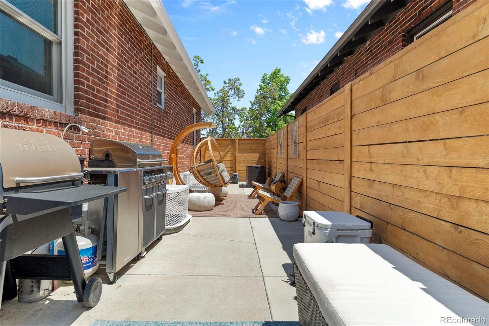 4319 Raritan Street Denver, CO 80211 - Photo 24 of 27 a backyard of a house with outdoor seating