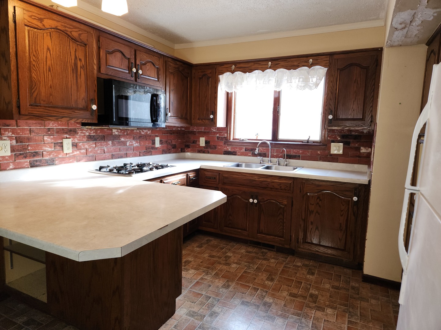 47 Route Maple Park Maple Park, IL 60151 - Photo 17 of 36 a kitchen with a sink a stove a microwave a sink and a refrigerator