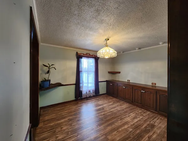 a view of balcony with wooden floor