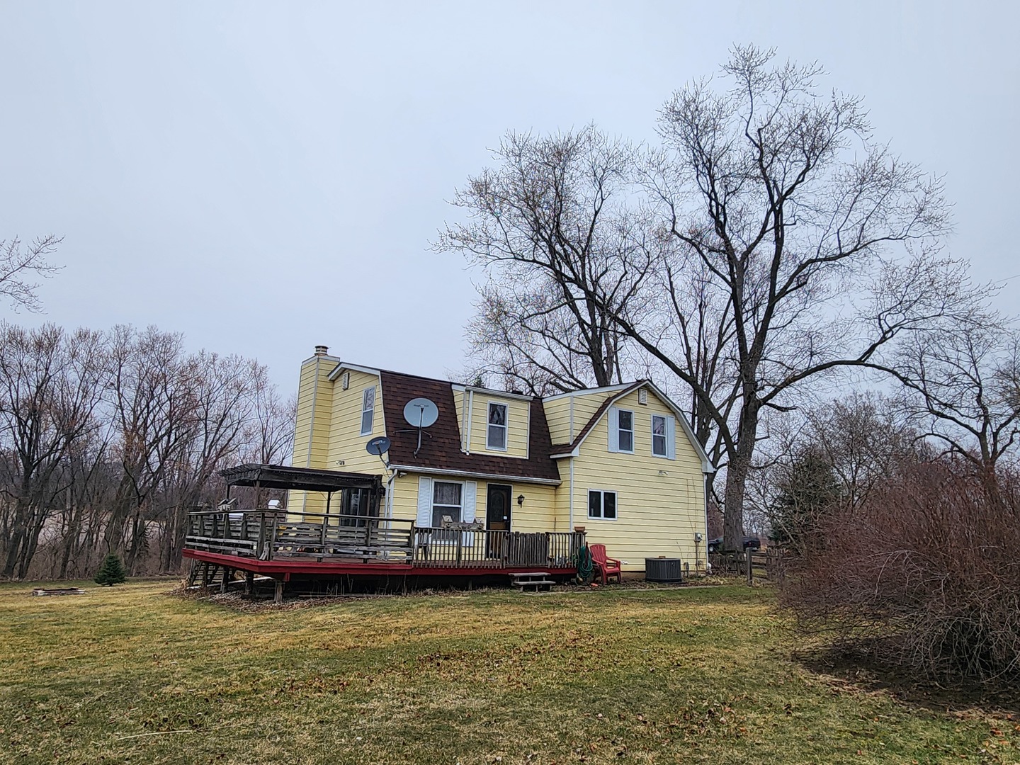 47 Route Maple Park Maple Park, IL 60151 - Photo 2 of 36 a view of a white house with a big yard and large trees