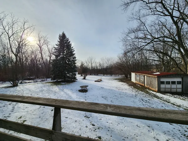 a picture of a bench in front of a building