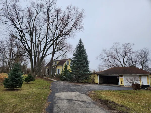a kitchen with a sink a stove a microwave a sink and a refrigerator