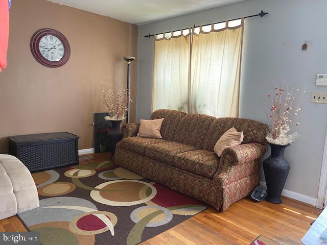 1310 Cedarcroft Road Baltimore, MD 21239 - Photo 4 of 22 Living Room With Natural Hardwood Floors