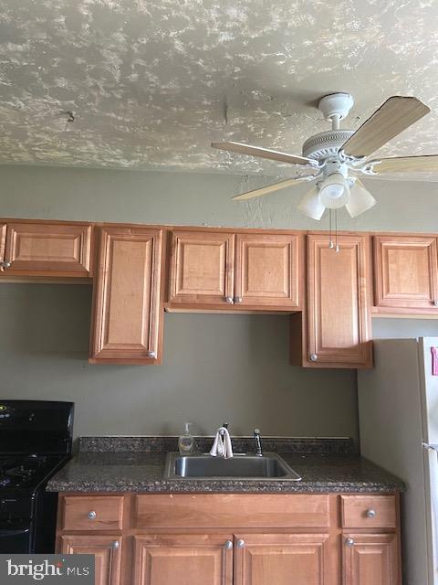 1310 Cedarcroft Road Baltimore, MD 21239 - Photo 9 of 22 Ceiling Fan and Stainless sink
