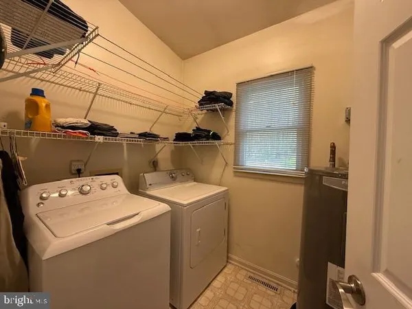 a utility room with dryer and washer