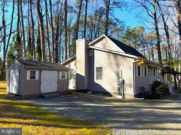 a view of a house with a yard and garage