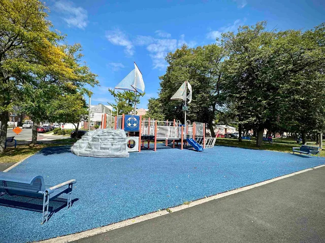 a view of street with parked cars