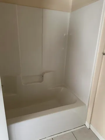 a close up of a bathtub in a bathroom