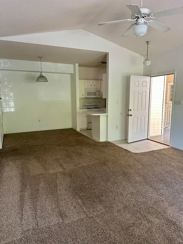 a view of a kitchen with a sink and cabinet area