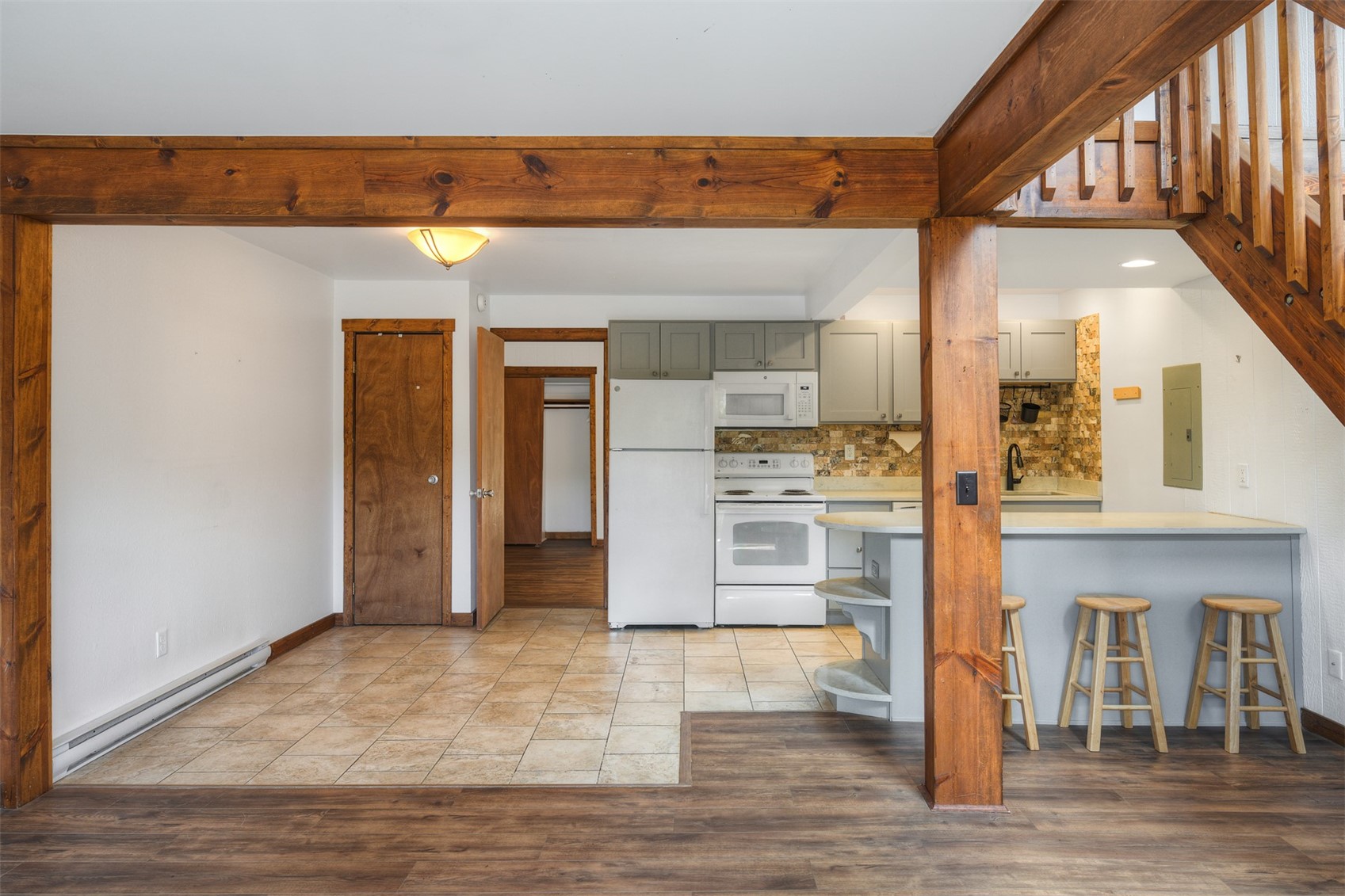 132 Illinois Gulch Road, Unit 3 Breckenridge, CO 80424 - Photo 2 of 32 a view of kitchen with stainless steel appliances cabinets and wooden floor
