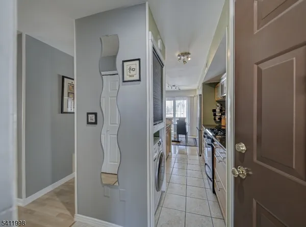 a hallway and a livingroom with furniture