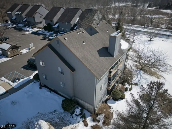 a roof deck view with a car parked in a yard
