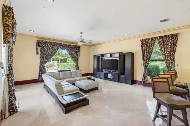 a kitchen with a stove a sink a refrigerator and a counter top space