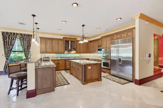 a bathroom with a sink vanity tub and a mirror
