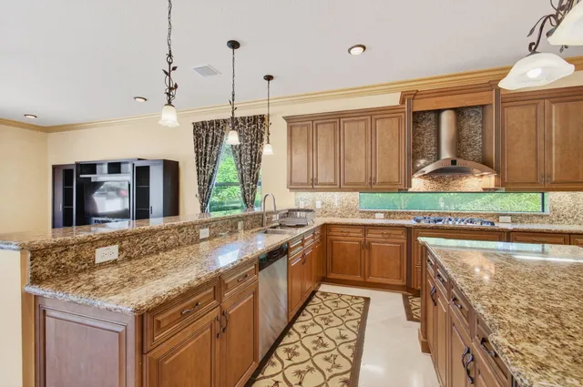 a view of a hallway with wooden floor and entryway