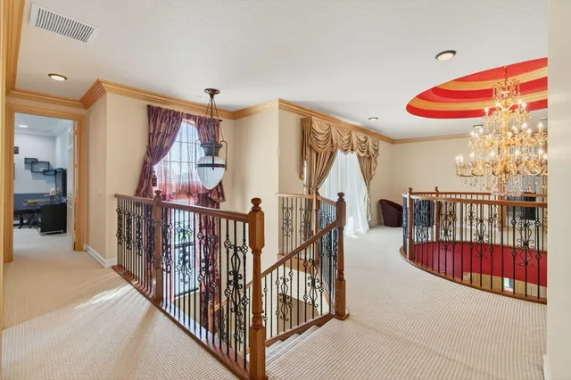 a aerial view of a house with yard and green space