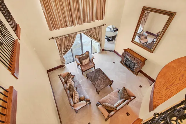 an aerial view of residential houses with outdoor space and swimming pool