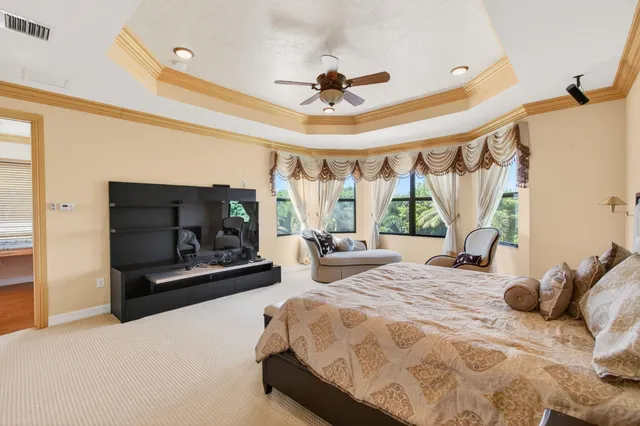 an aerial view of residential house with outdoor space and swimming pool