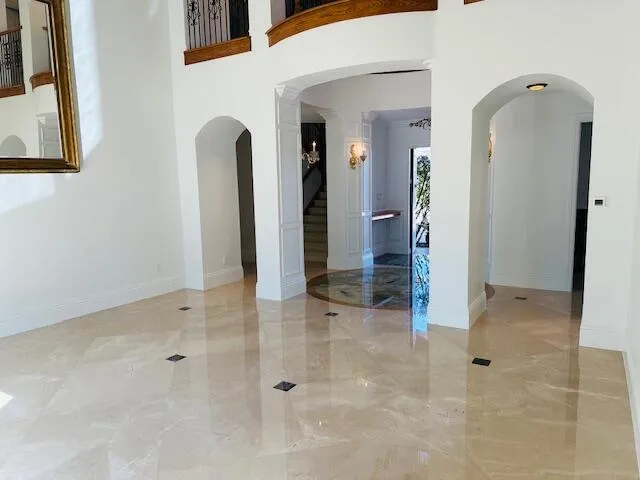 a view of a dining room with furniture and chandelier