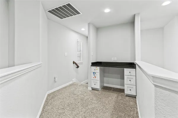 an empty room with a empty space and windows