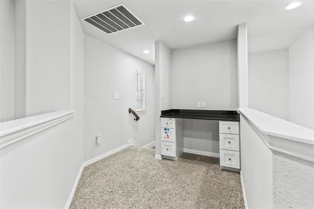 an empty room with a empty space and windows