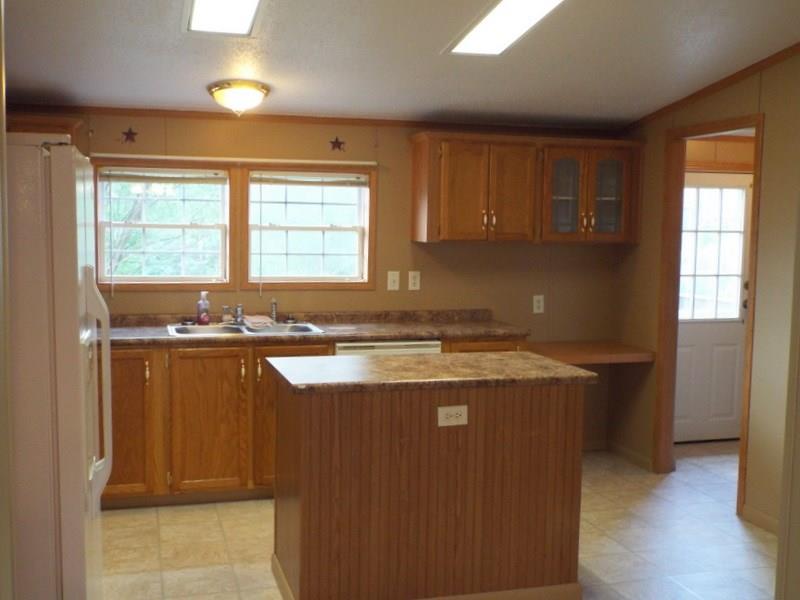 92 Traister Road Rimersburg, PA 16248 - Photo 7 of 22 Kitchen has had new cabinets installed and comes equipped with appliances. Room to the right is the Laundry room.