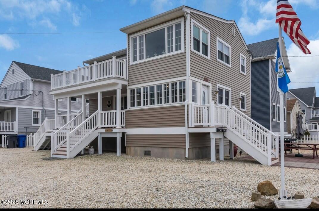 2020 Baltimore Avenue, Unit DOWN Seaside Heights, NJ 08751 - Photo 1 of 18 a front view of a house with a yard
